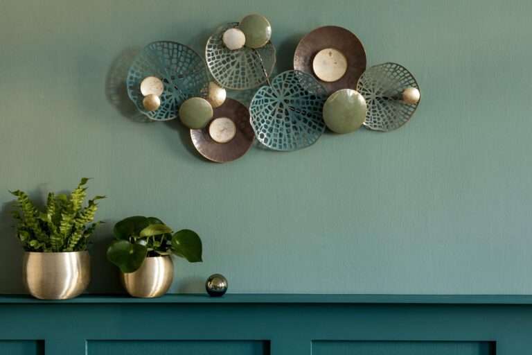 stylish-modern-composition-living-room-green-wall-panelling-with-shelf-beautiful-plants-gold-pots-decoration-elegant-personal-accessories-modern-home-decor-copy-space